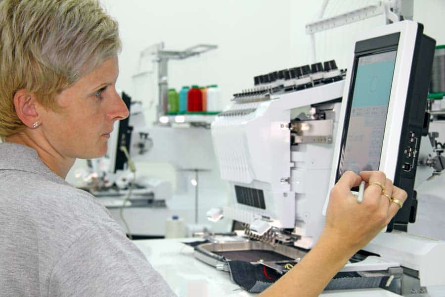 worker-digitizing-design-for-embroidery_900x600